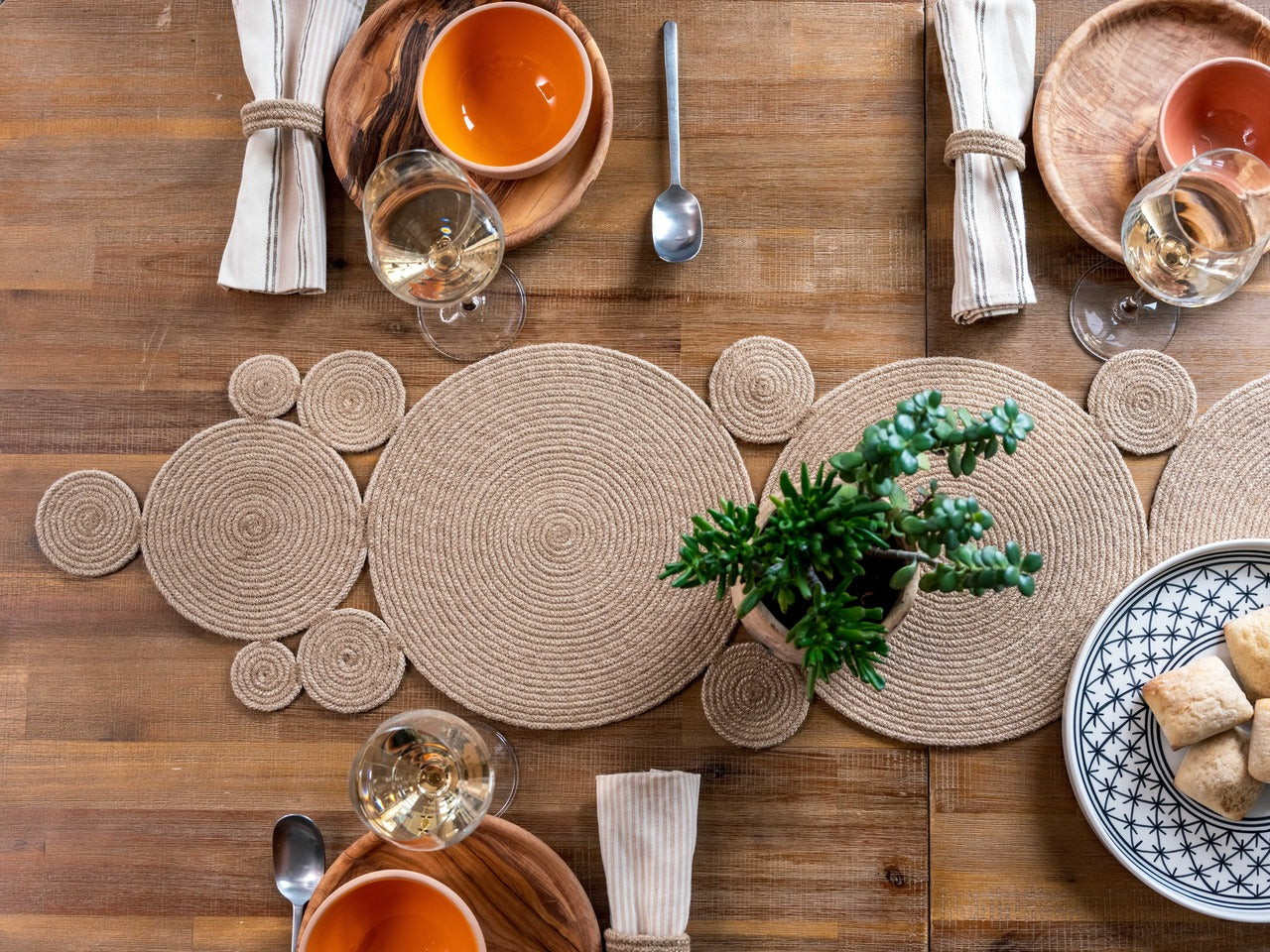 Showcasing a table that has been set with alfa fiber runner and coton napkins