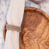 Halfa Napkin Ring around a napkin in Dora Wooden plate