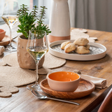 Table set up with ceramic, olive wood, halfa fiber dinnerware made in Tunisia