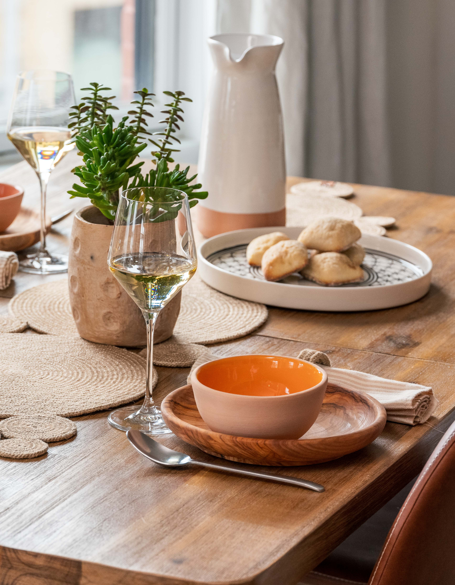 Table set up with ceramic, olive wood, halfa fiber dinnerware made in Tunisia