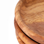 Close up detail of Dora olive wood plate