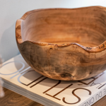 Rustic edges Wooden Bowl placed on an entryway console