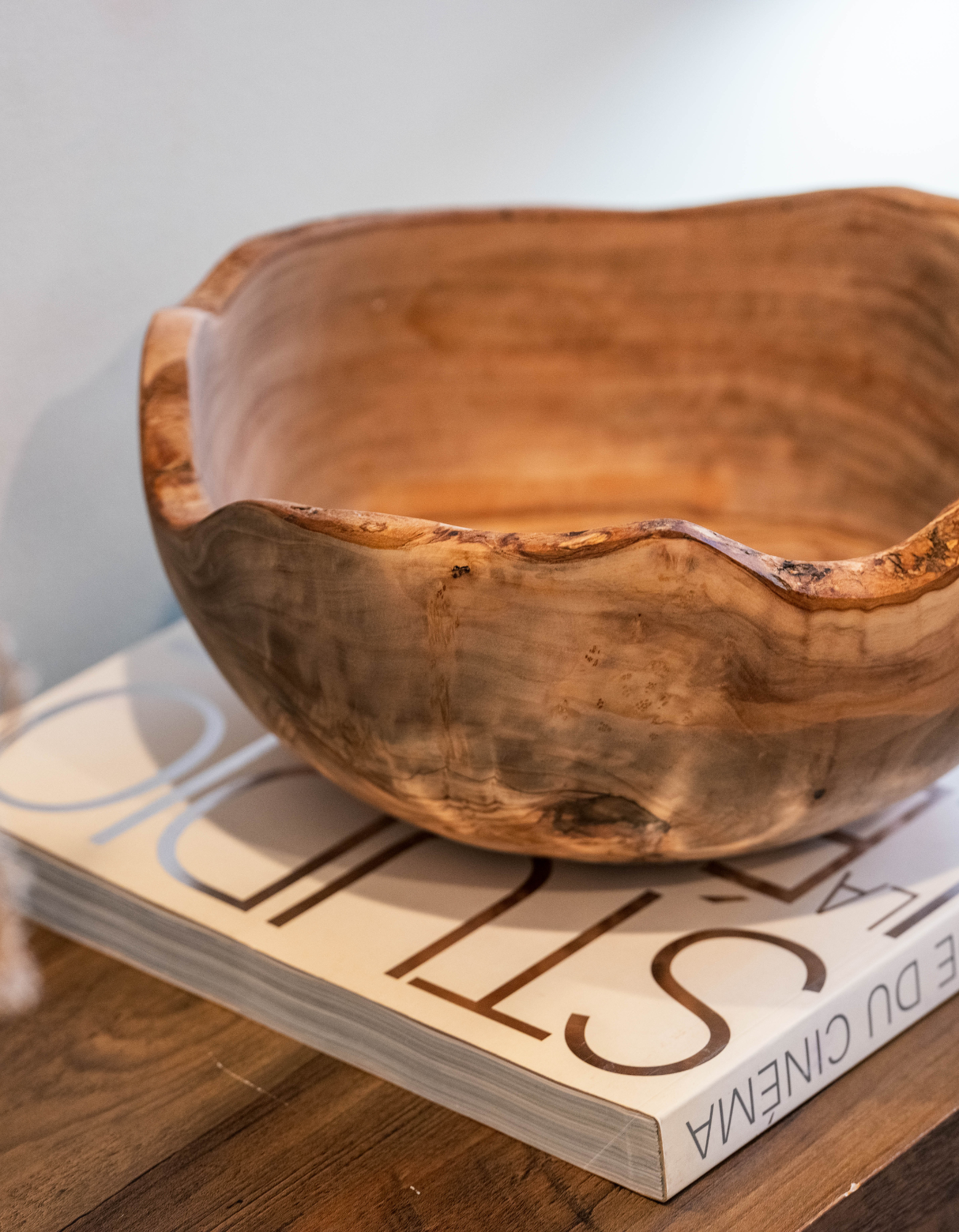 Rustic edges Wooden Bowl placed on an entryway console